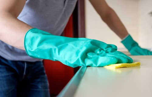 Technician vacuuming a mattress for deep cleaning in Osidge