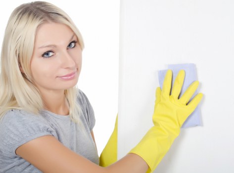 Worker following health and safety practices during carpet cleaning